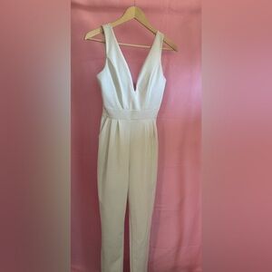 White Sleeveless Plunge Neckline Jumpsuit